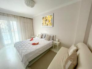 a bedroom with a bed and a couch in it at White House Kavala in Kavála
