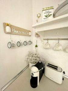 a kitchen counter with a toaster and a toaster at White House Kavala in Kavála