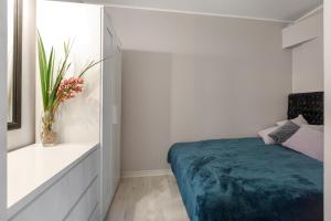 Säng eller sängar i ett rum på Riia maantee Apartement