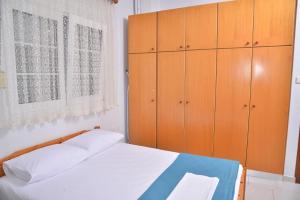 Postel nebo postele na pokoji v ubytování ZeusPlace Konaki House Leptokarya