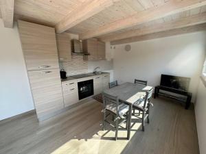 a kitchen with a table and chairs in a room at Casa Sant'Anna in Levanto