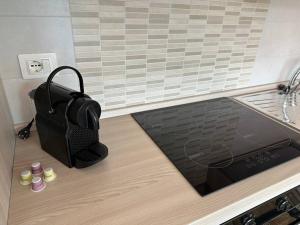 a black bag sitting on the counter of a kitchen at Casa Sant'Anna in Levanto +18 photos