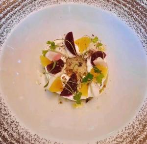 a white plate with a dessert on a table at Spring Gardens Retreat And Spa Private hottub,Sauna,Massage in Great Malvern