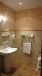 a bathroom with a sink and a mirror at Posada Ormas in Ormas