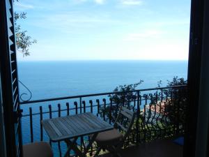 
a view from a balcony overlooking the ocean at Casa Bouganville in Positano
