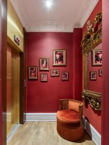 a red room with a chair and a red wall at Mr Cas Hotels Taksim - Special Category in Istanbul +96 photos