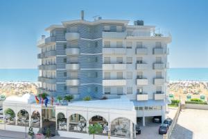a rendering of a building with the ocean in the background at Hotel Montecarlo in Caorle