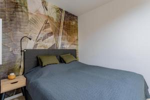 A bed or beds in a room at ERKEL 18 APARTMAN