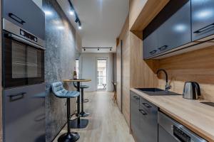 A kitchen or kitchenette at ERKEL 18 APARTMAN