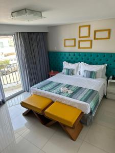 Cama ou camas em um quarto em Doral Guarujá