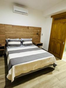 Postel nebo postele na pokoji v ubytování Hotel Paso Realce