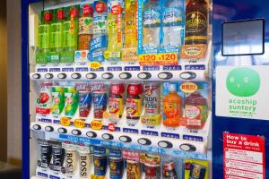 a refrigerator filled with lots of different types of drinks at Kuretake-Inn Kikugawa I.C. in Kikugawa