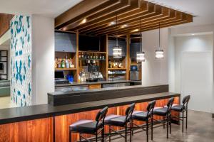 a bar with stools at a restaurant at Hyatt Place San Jose Airport in San Jose