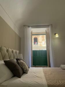 Postel nebo postele na pokoji v ubytování Immacolata Rooms