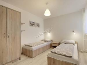 Posteľ alebo postele v izbe v ubytovaní Apartament Melisa