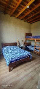 a bedroom with two beds and a cat sitting on the floor at Casa Villa Alive - Vichayito Sur, Los Organos Talara in San Martín +42 photos