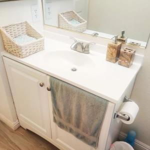 a bathroom sink with a towel hanging from it at Nice Private Room Near Red Rock & Las Vegas Strip in Las Vegas