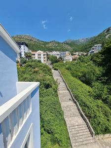 a stairway leading up to a hill with buildings at The View Sveti Stefan V2 in Sveti Stefan