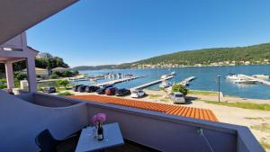 a balcony with a view of a marina at Miljenko&Miljenka in Supetarska Draga