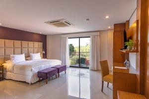 Kama o mga kama sa kuwarto sa Las Lomas Casa Hotel