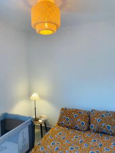 Postel nebo postele na pokoji v ubytování Bienvenue chez Méli et Dorian + 8 fotografií