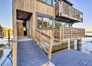 a house on the water with a dock at Floating Condos of Commodore 11 in Mill Valley