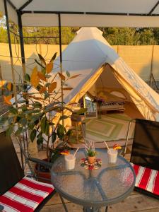 a tent with a table in front of it at Estera Tent Camping in Zadar