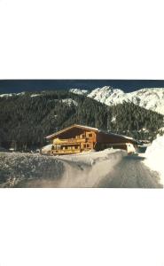 a building on the side of a snow covered mountain at apart strolz in Sankt Anton am Arlberg