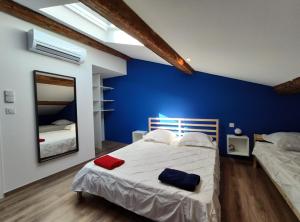 Postel nebo postele na pokoji v ubytování ColorMix 3 étoiles - 95m2 Plein Centre - Ensoleillé Climatisé