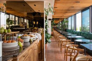 two images of a restaurant with tables and chairs at L'Avventura Athens in Athens
