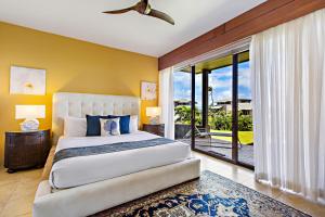 a bedroom with a large bed and a balcony at Kapalua Bay Villa 33G4 in Kahana +34 photos