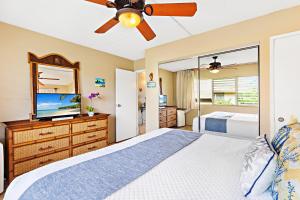 Ένα ή περισσότερα κρεβάτια σε δωμάτιο στο Kihei Kai Nani 368 +17 φωτογραφίες