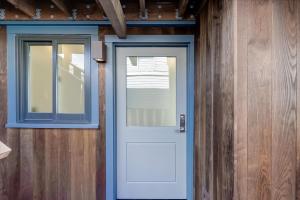 a blue door in a room with a window at Floating Condos of Commodore 11 in Mill Valley