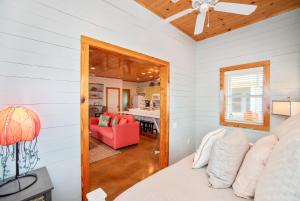 a bedroom with a bed and a living room at The RITZ Tarpon- VW 83 in Port Aransas