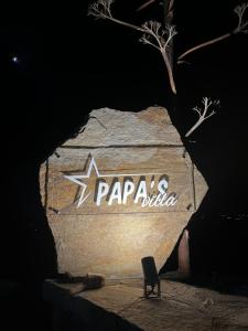 a sign for papa ricotta on a rock at night at Villa Papa in Glinádhon