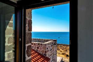 a window view of the ocean from a house at Seaview Villa in Tavari