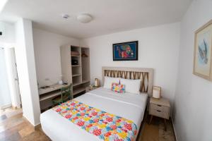 Cama ou camas em um quarto em Atoq Paracas Reserva
