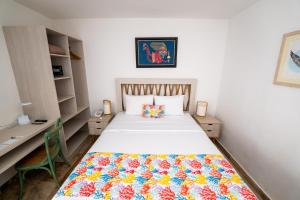Cama ou camas em um quarto em Atoq Paracas Reserva