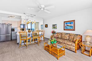 a living room with a couch and a table at Paki Maui 403 in Kahana
