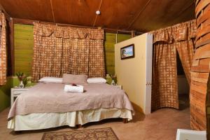 A bed or beds in a room at Strawberry Fields Together