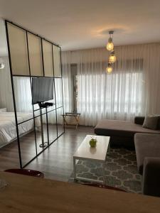 a living room with a couch and a tv at Quartier Dorrego in Buenos Aires
