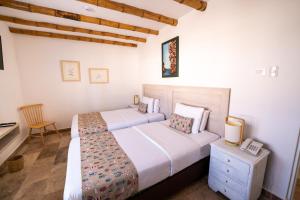 Cama ou camas em um quarto em Atoq Paracas Reserva