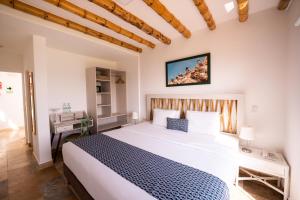 Cama ou camas em um quarto em Atoq Paracas Reserva
