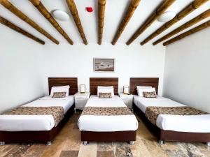 Cama ou camas em um quarto em Atoq Paracas Reserva