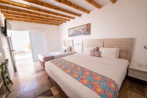 Cama ou camas em um quarto em Atoq Paracas Reserva