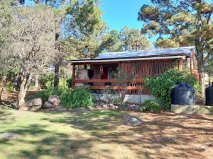 a small house in the middle of a yard at Luna Plateada - Terrafirme in Villa Yacanto