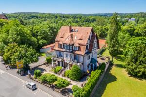 an aerial view of a house with a car parked in front at Gästehaus Mittmann in Bad Kissingen