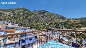 a view of the mountains from the balcony of a building at Casa Meftah Blue in Chefchaouene