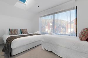 מיטה או מיטות בחדר ב-Cardrona Vista Apartment