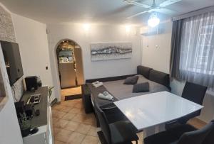 a living room with a couch and a table at Apartments with WiFi Vis - 19923 in Vis